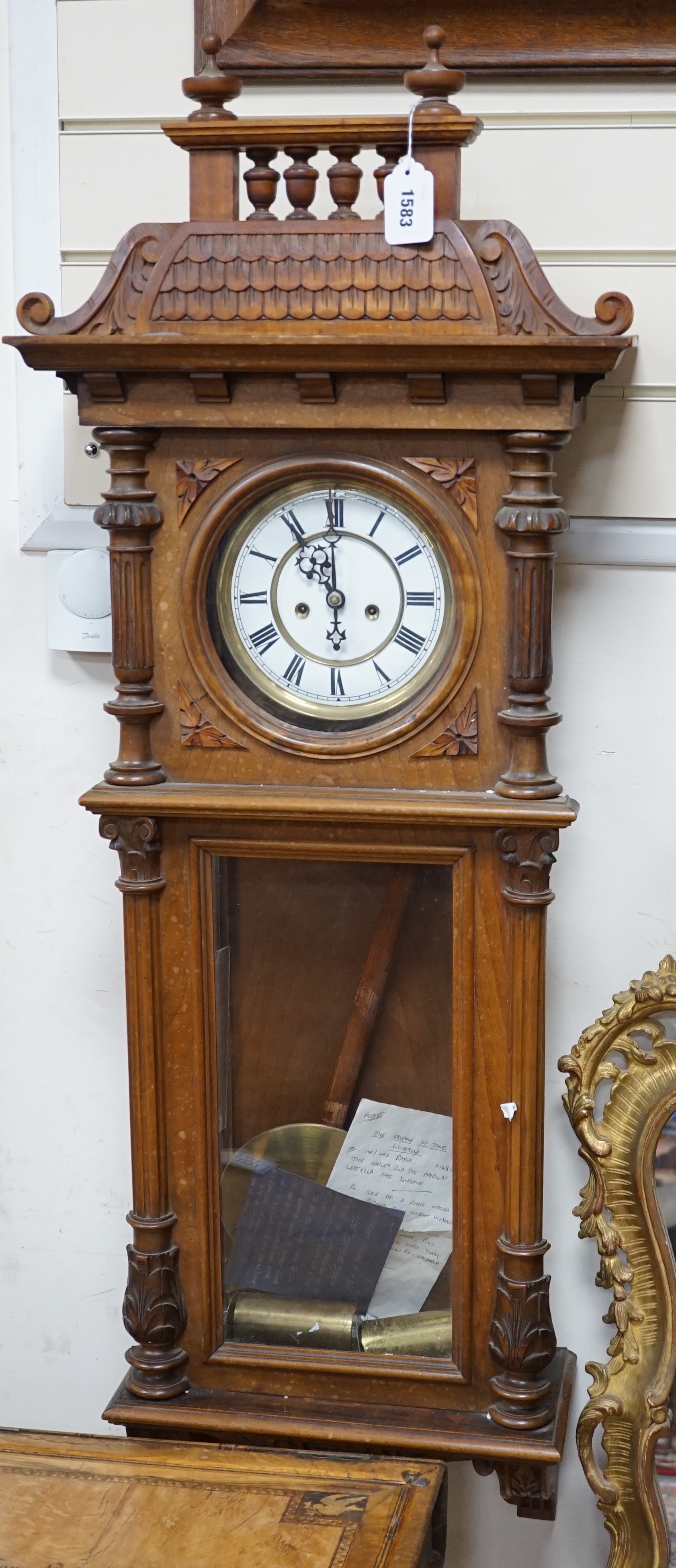 A weight driven Vienna walnut wall clock